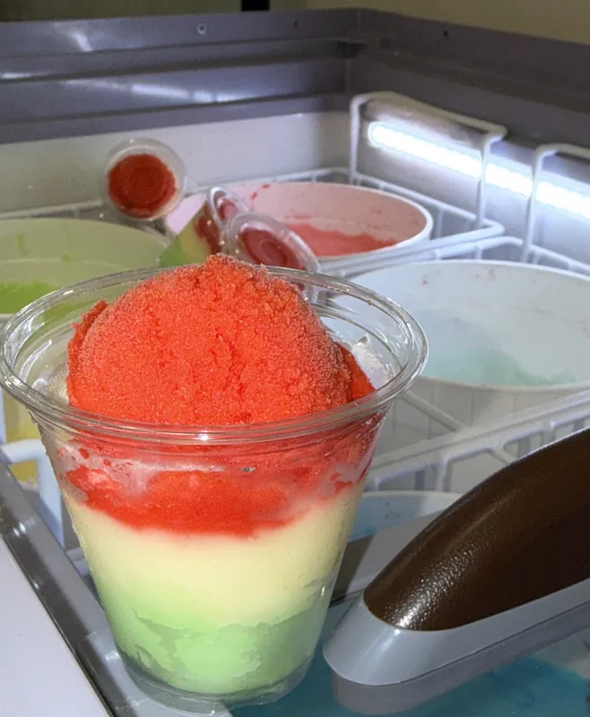 Layered red and green water ice