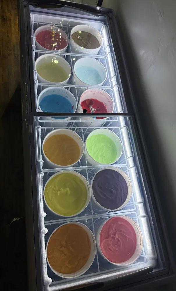 Freezer case full of fresh water ice flavors