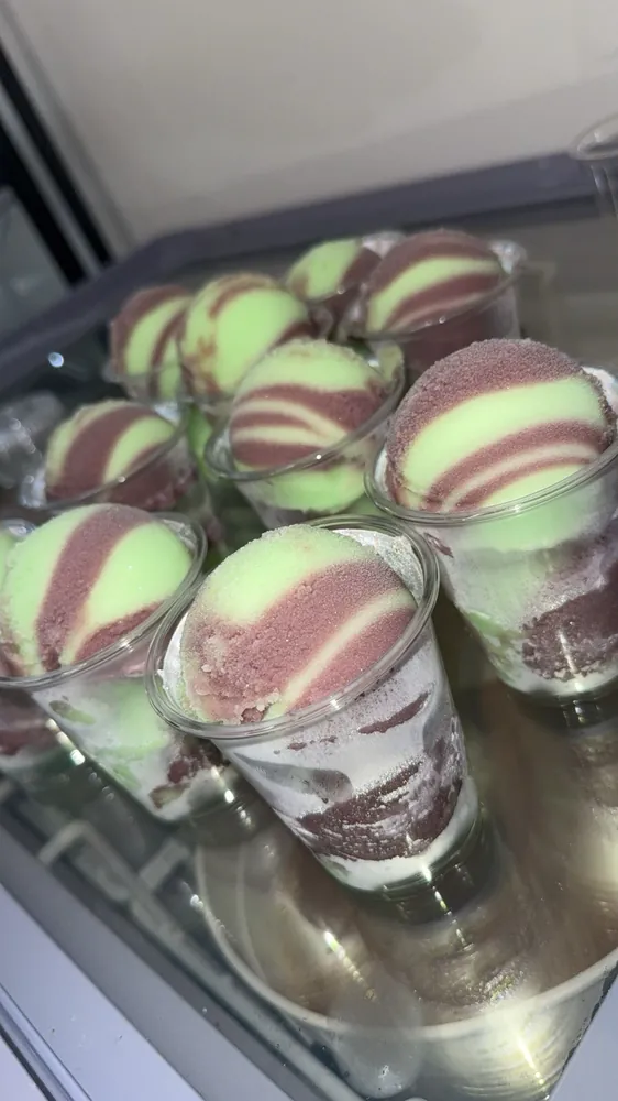 A tray of water ice cups prepped for an event